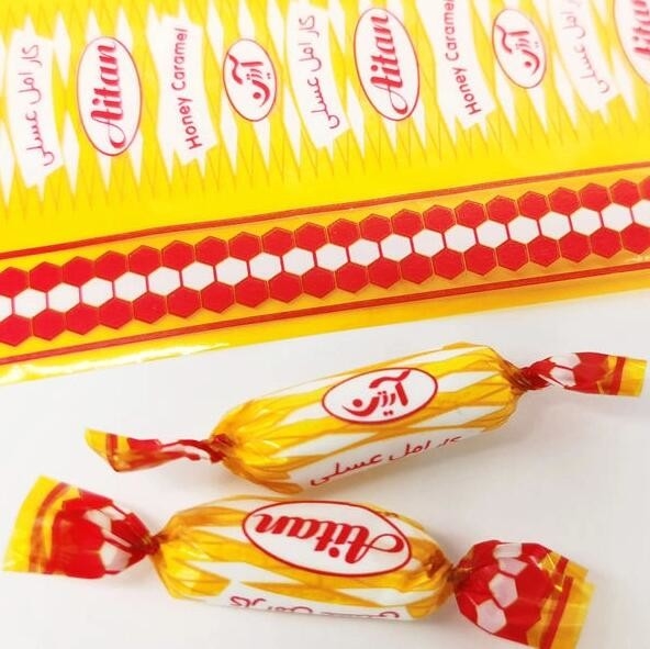 Impression d'emballages de bonbons transparents en PVC avec des couleurs irisées arc-en-ciel